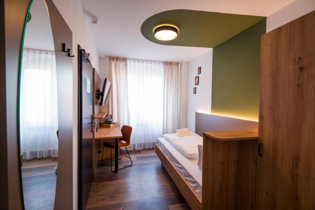 Postel nebo postele na pokoji v ubytování Hotel Sandkorn