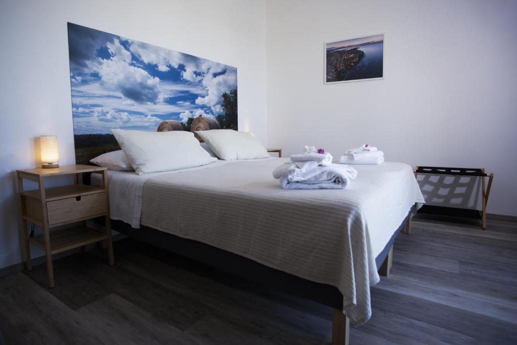 Postel nebo postele na pokoji v ubytování B&B Hill Ranch