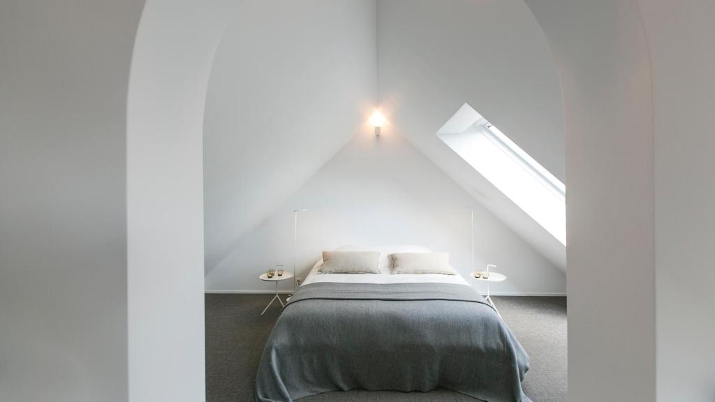 Postel nebo postele na pokoji v ubytování côté verger B&B