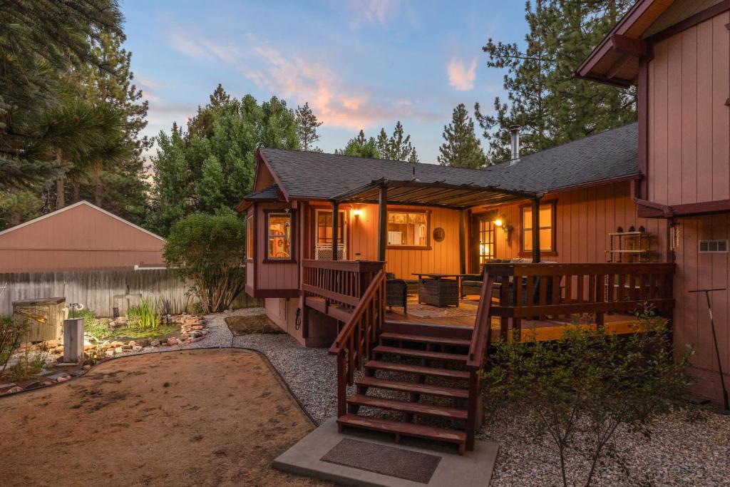 a home with a staircase leading to a house at Mountain Retreat Woodburning Fireplace Games in Big Bear City
