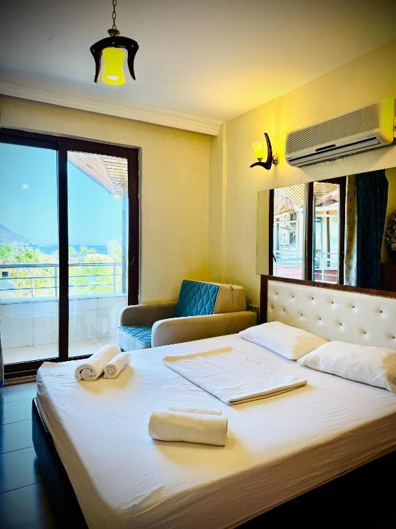 Postel nebo postele na pokoji v ubytování Adrasan Yazıcı Hotel