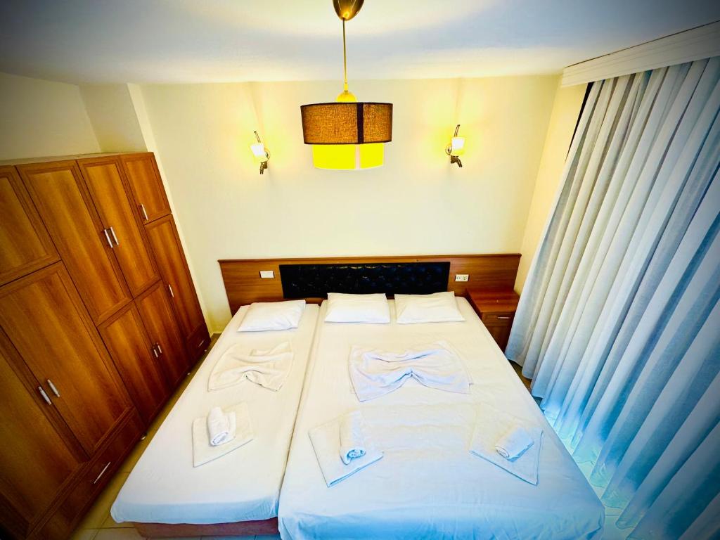 Postel nebo postele na pokoji v ubytování Adrasan Yazıcı Hotel