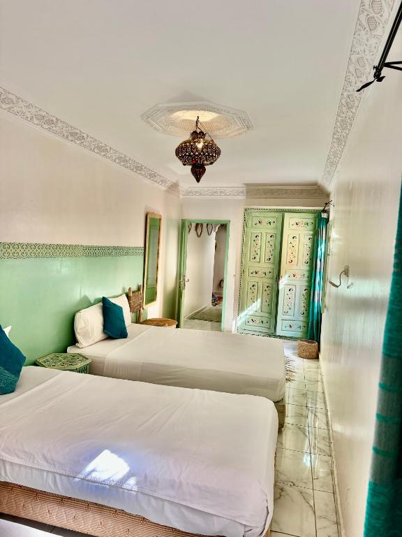 Postel nebo postele na pokoji v ubytování Riad Cascada