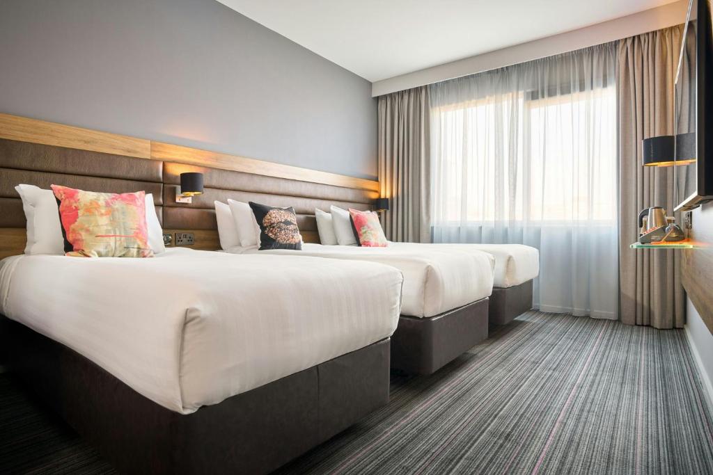 Una cama o camas en una habitación de Moxy Dublin City