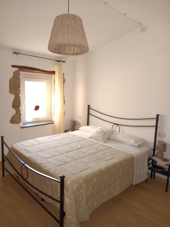 A bed or beds in a room at Alloggio Turistico Civico 4