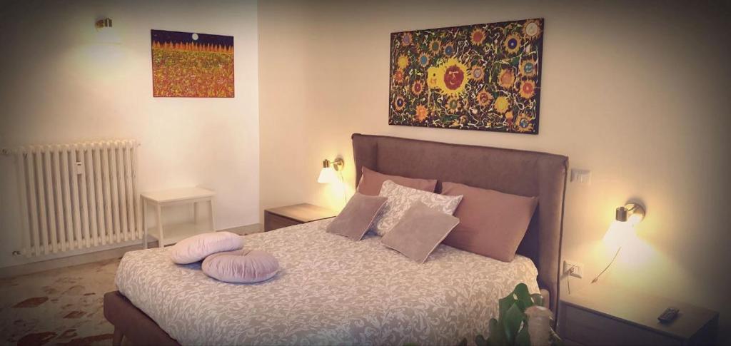 Postel nebo postele na pokoji v ubytování Suite Chiara