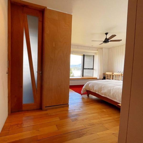 Postel nebo postele na pokoji v ubytování Hotel Casa Panguipulli