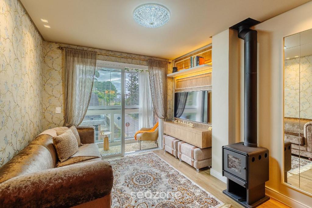 Μια τηλεόραση ή/και κέντρο ψυχαγωγίας στο Apto aconchegante temático em Canela | DAL221