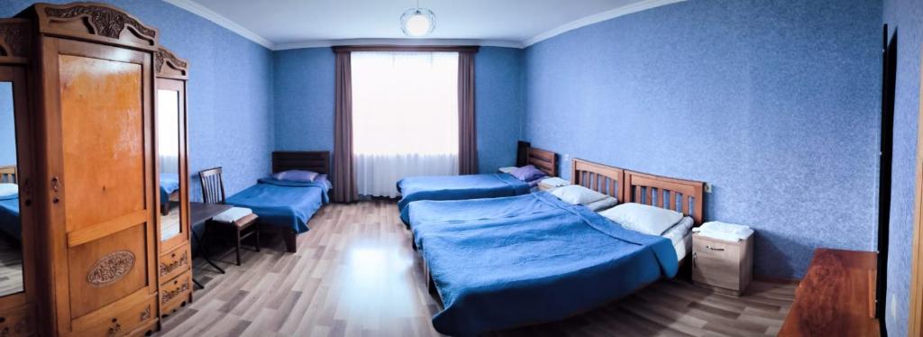 Ένα ή περισσότερα κρεβάτια σε δωμάτιο στο Kamara Guest House