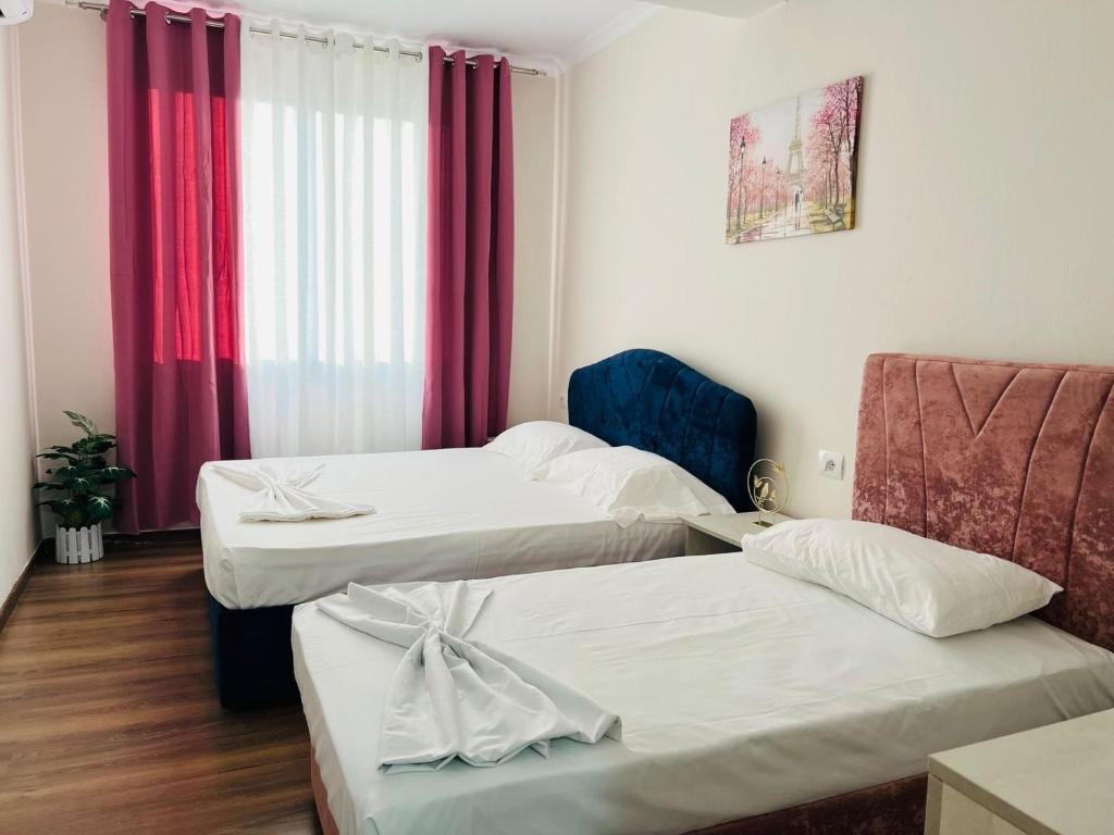 Postel nebo postele na pokoji v ubytování SARVI Apartments