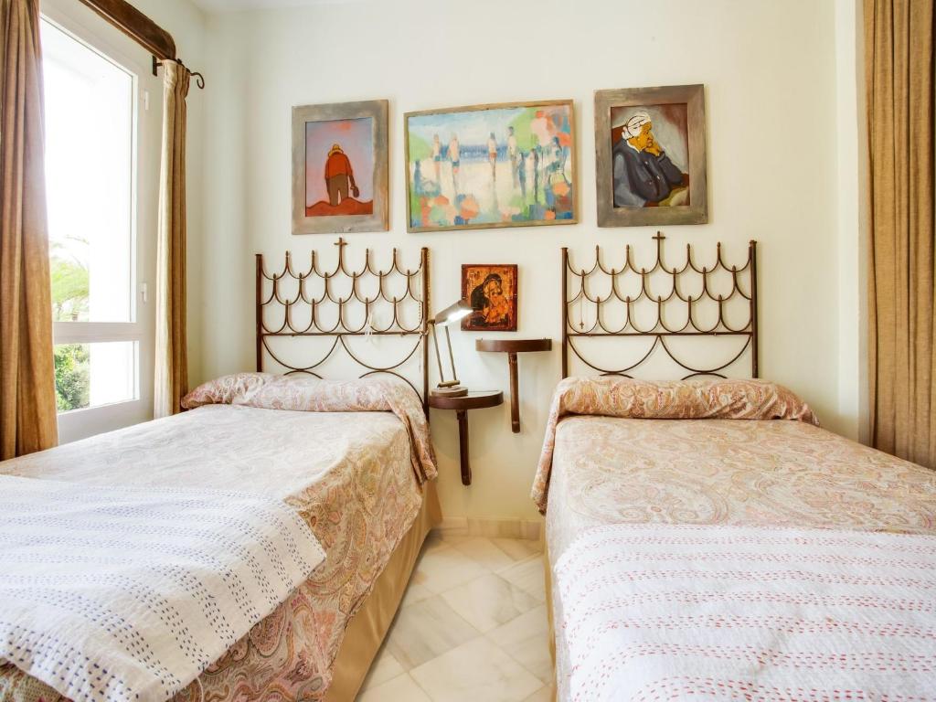 Postel nebo postele na pokoji v ubytování Belvilla by OYO Apartment in SAN ROQUE CADIZ