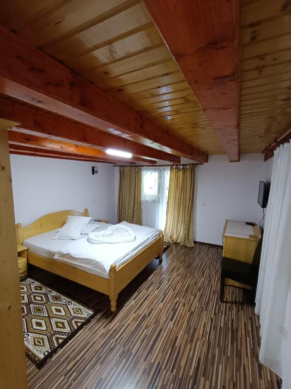 Postel nebo postele na pokoji v ubytování Cabana Daianna si Jessica