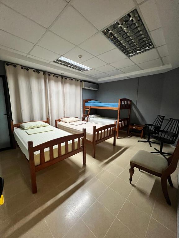 Voodi või voodid majutusasutuse Panama Hat Hostel toas