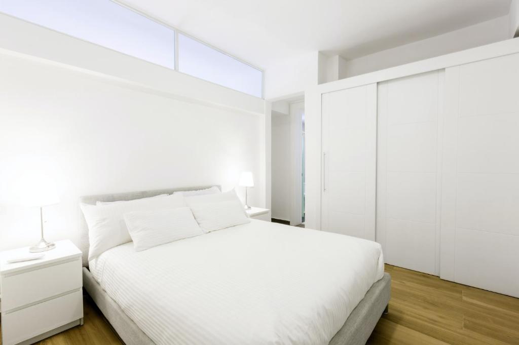 Krevet ili kreveti u jedinici u okviru objekta OLAS DEL CARIBE - VACATION SUITES with ROOFTOP POOL - PLAYA LOS CORALES