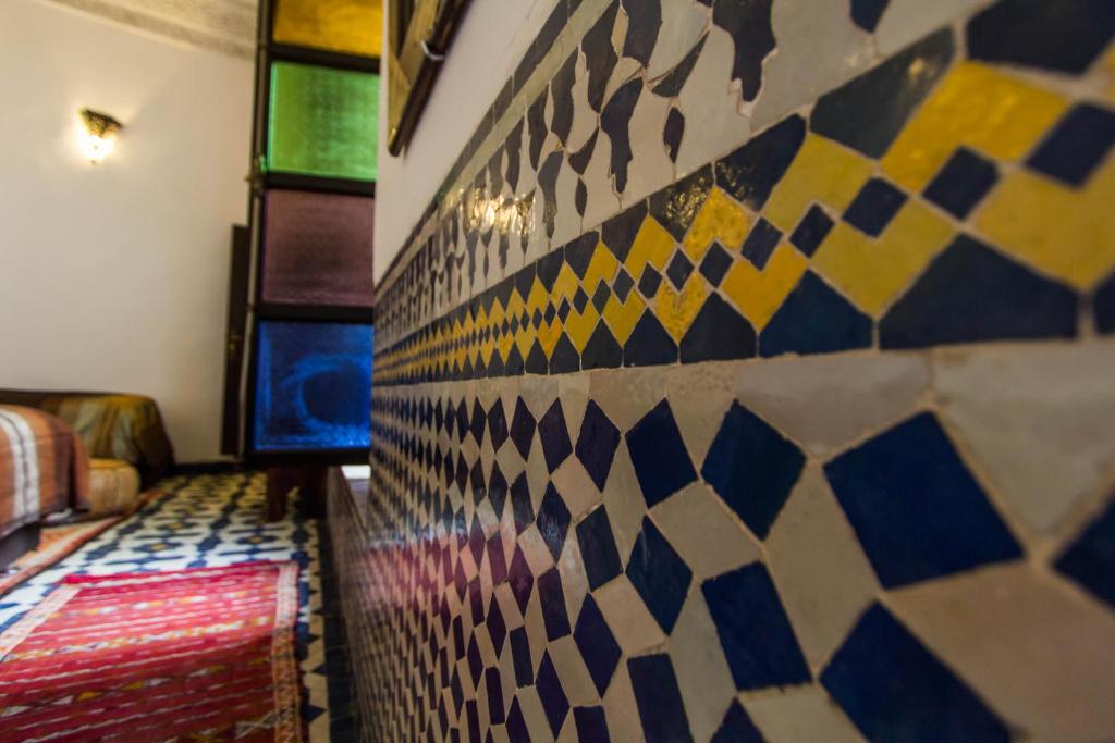 Postel nebo postele na pokoji v ubytování Riad Taha