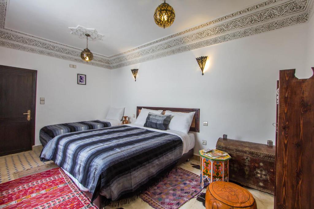 Postel nebo postele na pokoji v ubytování Riad Taha
