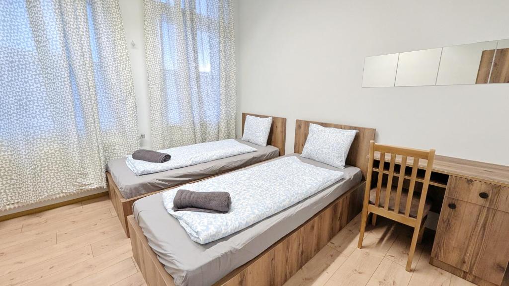 Postel nebo postele na pokoji v ubytování Spacious Rooms - 15 Min from Airport & City Center, 5 Min from Vienna Main-Bus Station EZ9