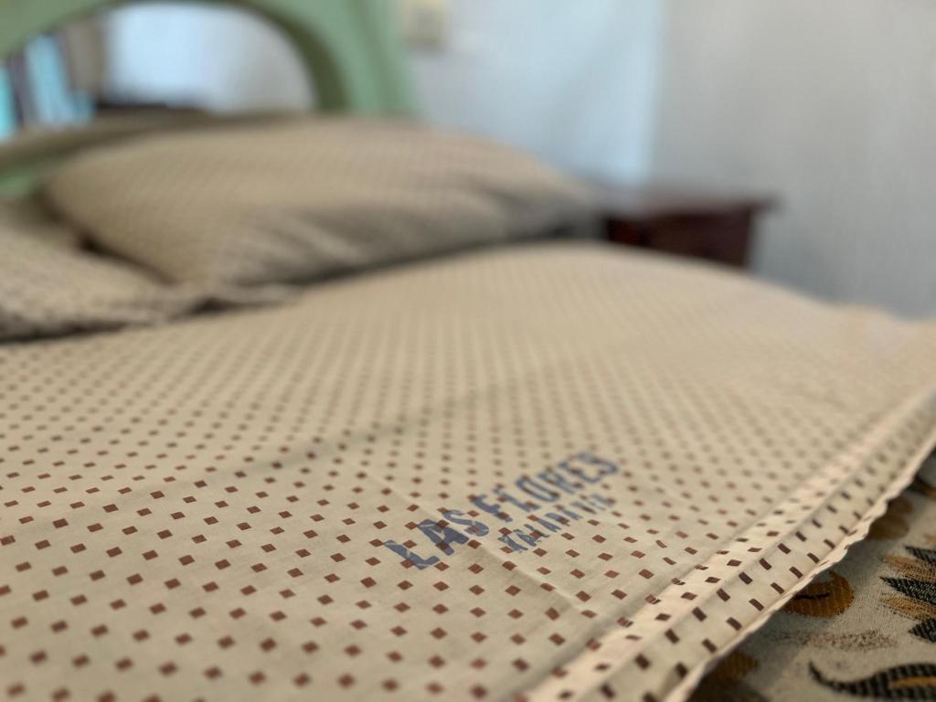 Postel nebo postele na pokoji v ubytování Hotel Las Flores
