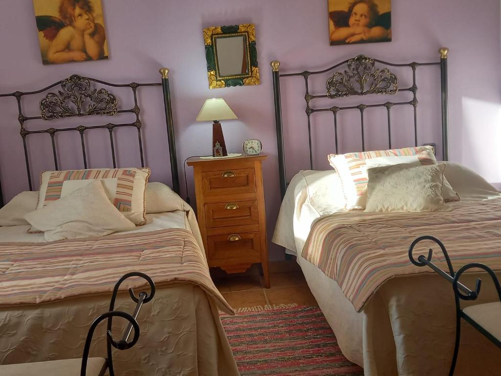 Postel nebo postele na pokoji v ubytování CASA RuRAL LOS DESAYUNOS