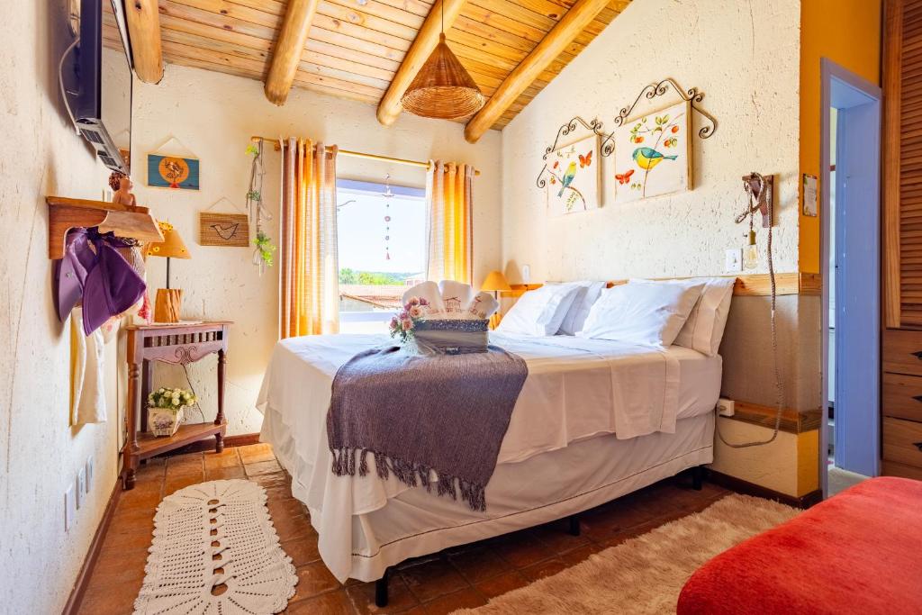 Postel nebo postele na pokoji v ubytování Casinha Ipê Roxo - Condomínio Quinta do Rosário