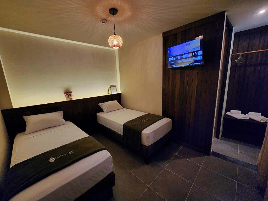 Postel nebo postele na pokoji v ubytování China Chancay Hotel