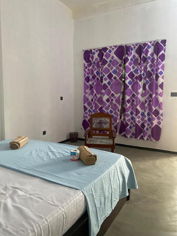 Postel nebo postele na pokoji v ubytování One FS Hotel Arugambay