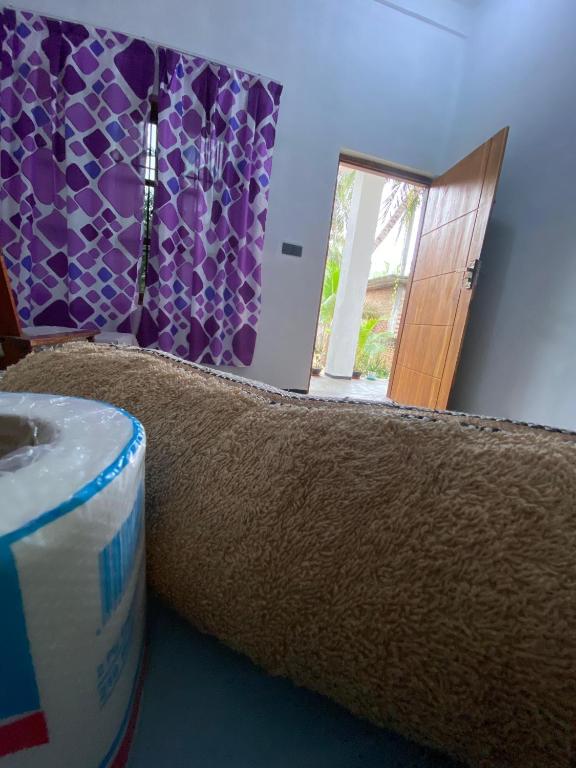 Postel nebo postele na pokoji v ubytování One FS Hotel Arugambay