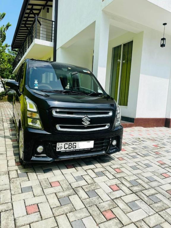 a black truck parked in front of a building at Rent a car sri lanka in Kaduwela