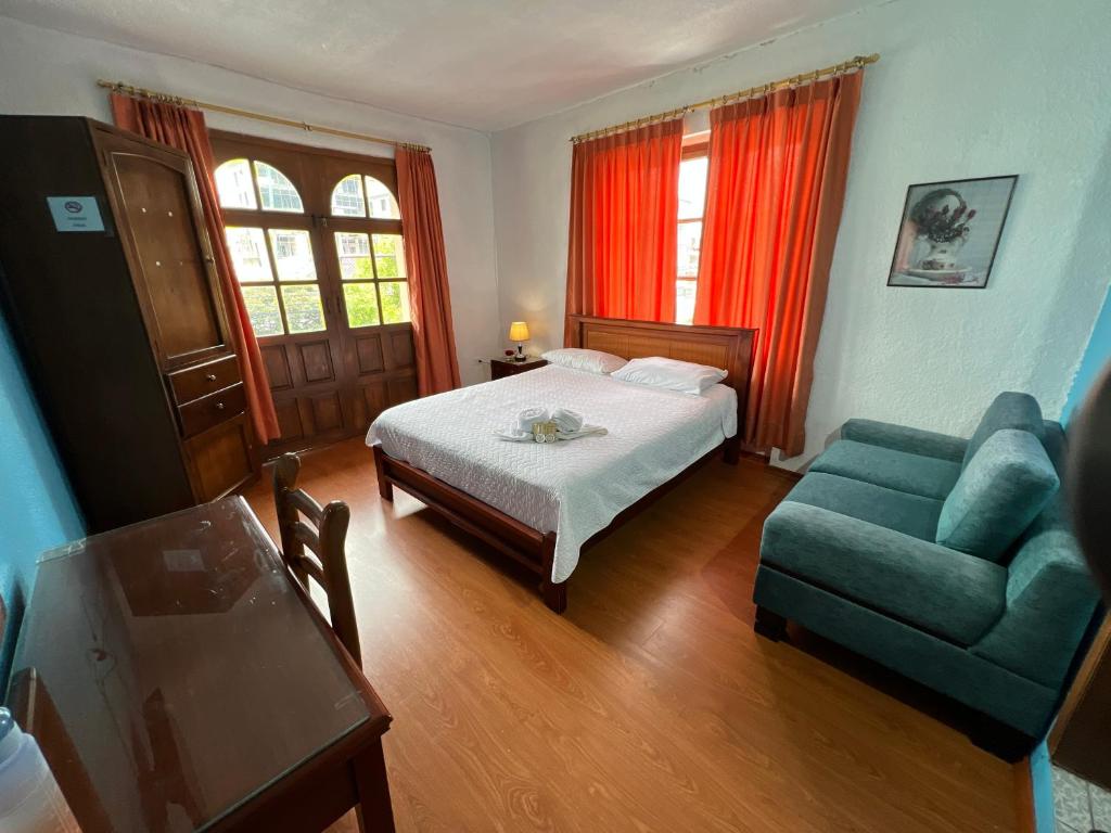 Postel nebo postele na pokoji v ubytování Hostal Barón de Carondelet