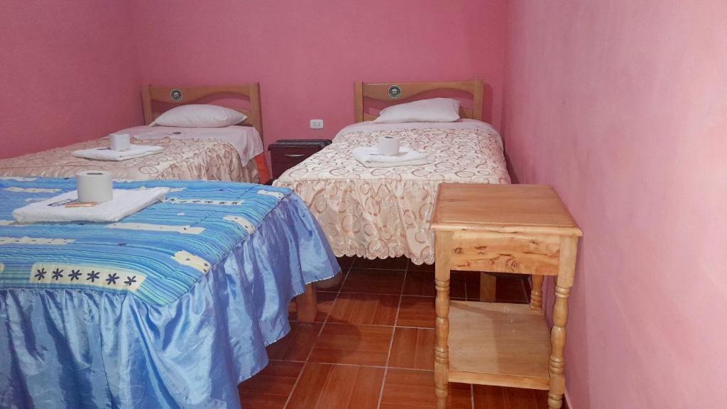 Postel nebo postele na pokoji v ubytování Jaimes Inn Hostel