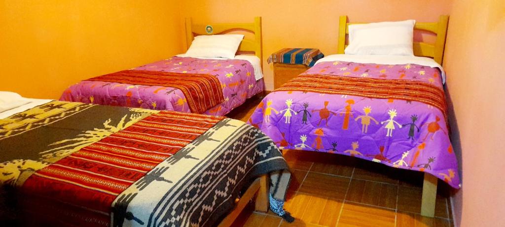 Postel nebo postele na pokoji v ubytování Jaimes Inn Hostel