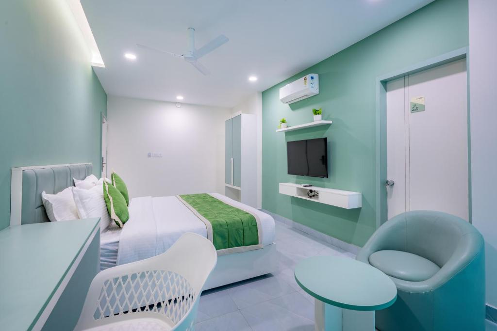 Postel nebo postele na pokoji v ubytování Grace Suites