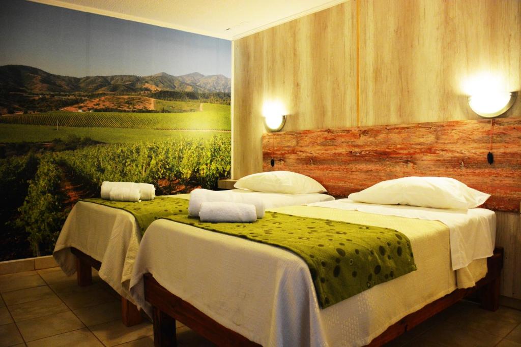 Postel nebo postele na pokoji v ubytování Hostal Valle Mistral