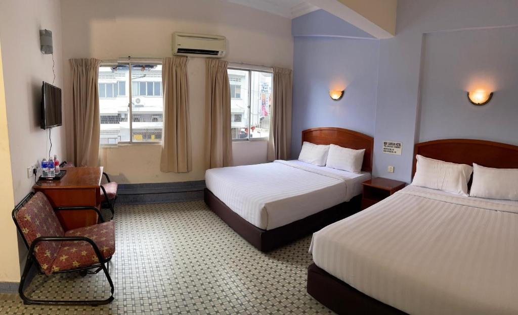 Postel nebo postele na pokoji v ubytování New Caspian Hotel