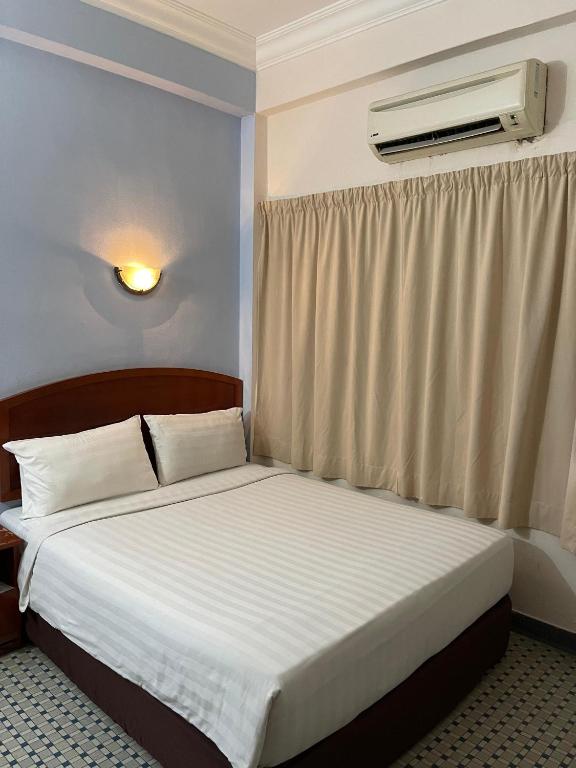 Postel nebo postele na pokoji v ubytování New Caspian Hotel