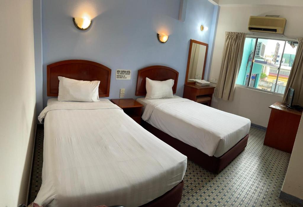 Postel nebo postele na pokoji v ubytování New Caspian Hotel