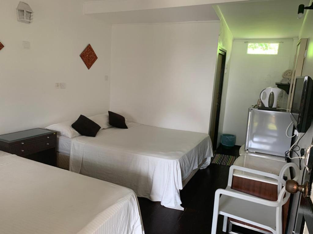 Postel nebo postele na pokoji v ubytování Nipah Bay Villa