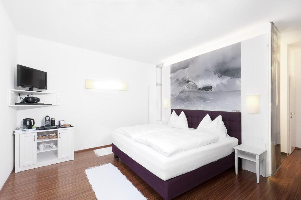 Postel nebo postele na pokoji v ubytování Hotel Payerbacherhof