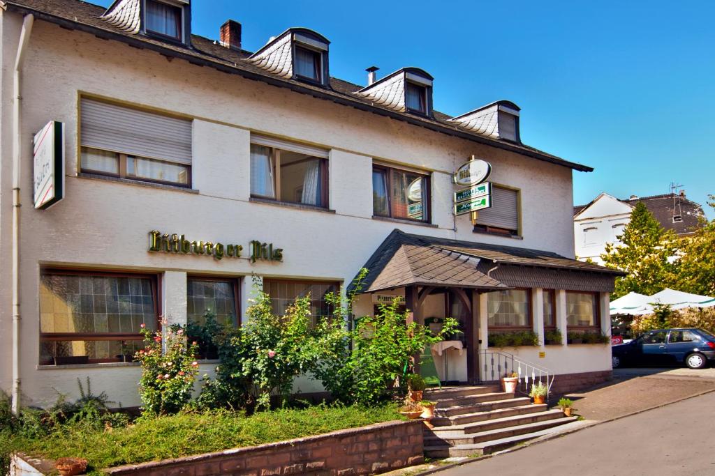 a building with a sign on the side of it at Hotel Kugel in Trier