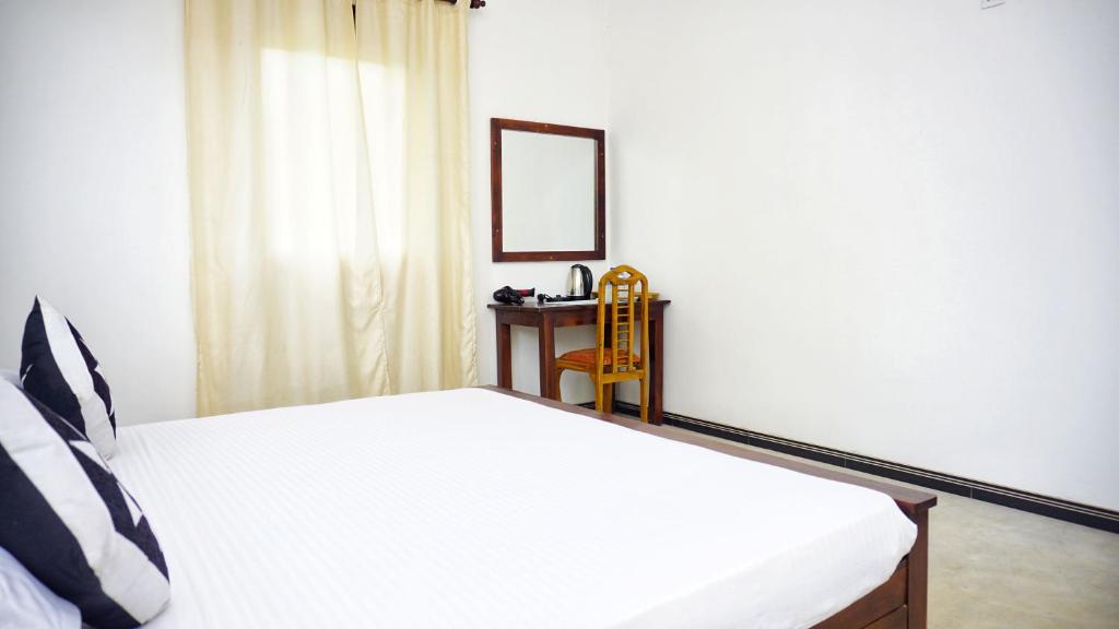Postel nebo postele na pokoji v ubytování Jungle Edge Home Sigiriya