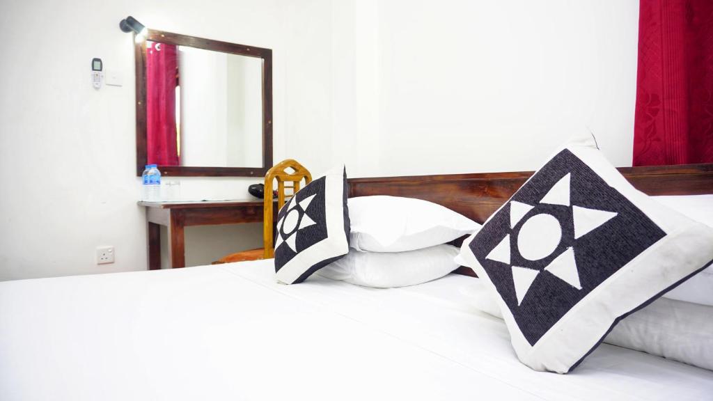 Postel nebo postele na pokoji v ubytování Jungle Edge Home Sigiriya