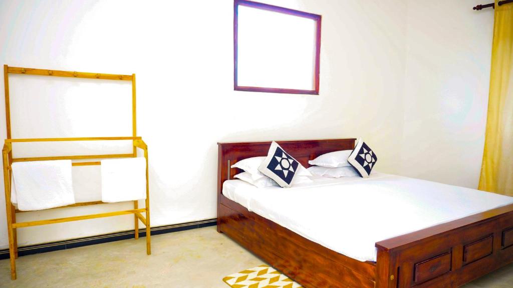 Postel nebo postele na pokoji v ubytování Jungle Edge Home Sigiriya