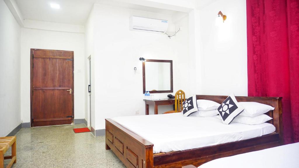 Postel nebo postele na pokoji v ubytování Jungle Edge Home Sigiriya