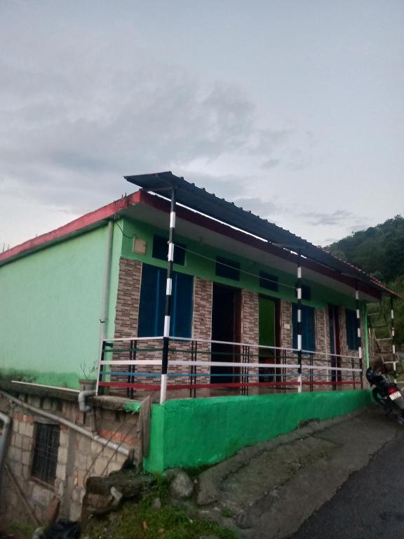 a small house with a green at Khoyal home stay in Jāmb