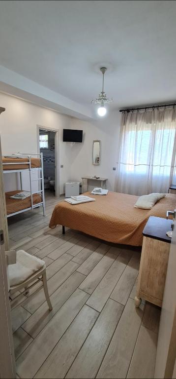 Postel nebo postele na pokoji v ubytování Quarantotto B&B
