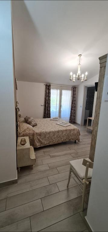Postel nebo postele na pokoji v ubytování Quarantotto B&B