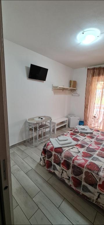 Postel nebo postele na pokoji v ubytování Quarantotto B&B