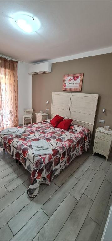 Postel nebo postele na pokoji v ubytování Quarantotto B&B