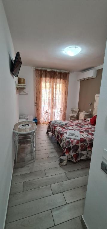 Postel nebo postele na pokoji v ubytování Quarantotto B&B