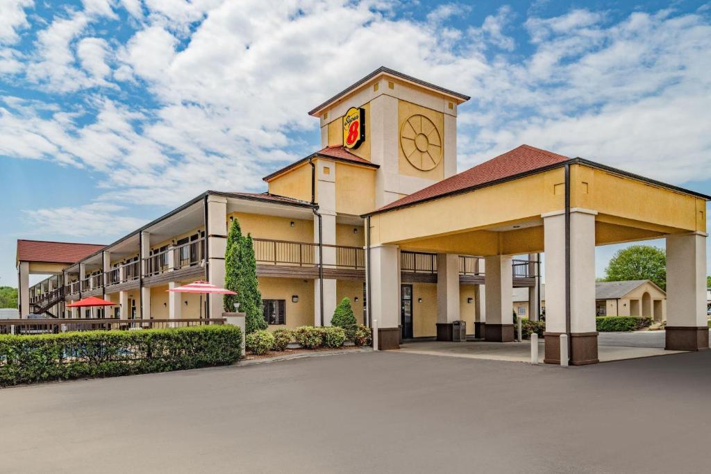 a building with a clock tower on top of it at Super 8 by Wyndham Columbia in Columbia